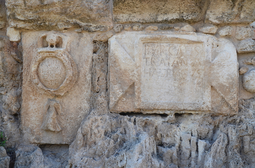 Dedicatory inscription to Hadrian on the high-level aqueduct of Caesarea at Beit Hanania with the emblem depicting the 10th legion.