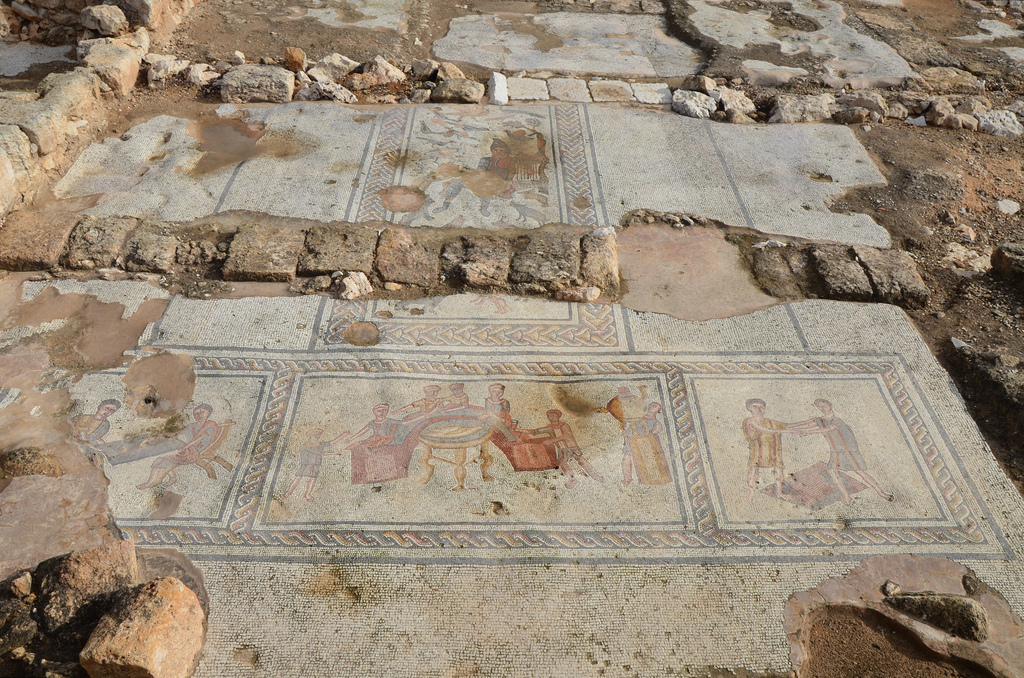T-shaped mosaic in the triclinium of The House of Orpheus containing four panels arranged for viewing from the south.