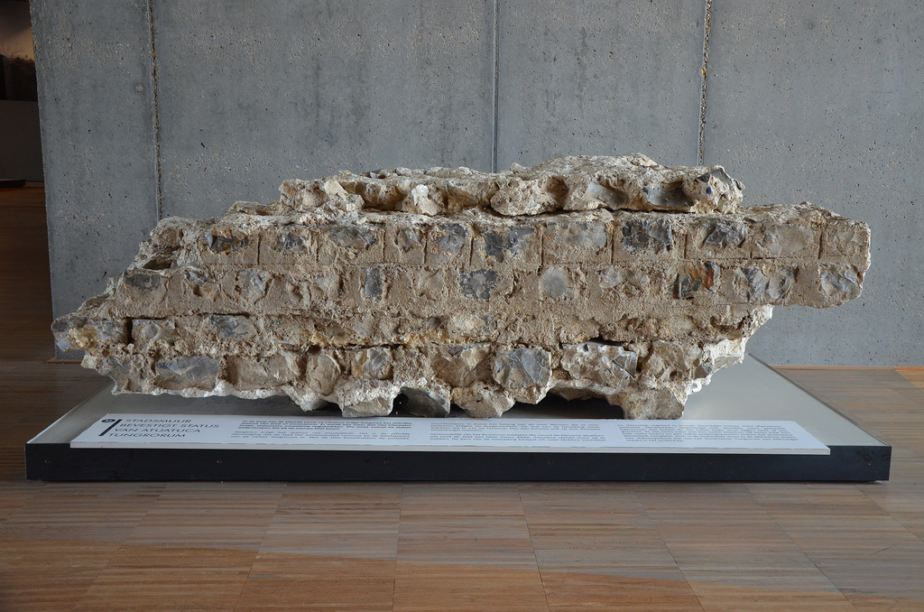 Fragment of the city walls consisting of rough blocks of flint and rubble set in mortar, the city walls were built in the 2nd centuy AD and were more than 4km in length. Gallo-Roman Museum of Tongeren, Belgium.