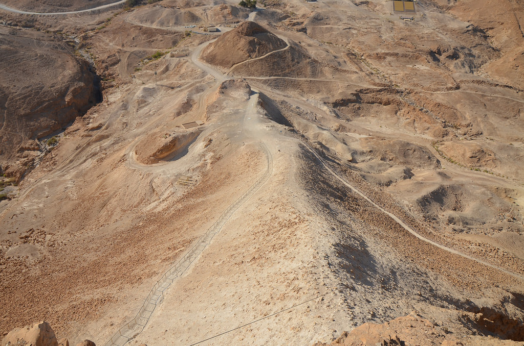 View from the hilltop of Masada of the Roman siege ramp and remnants of Camp E, one of several legionary camps.
