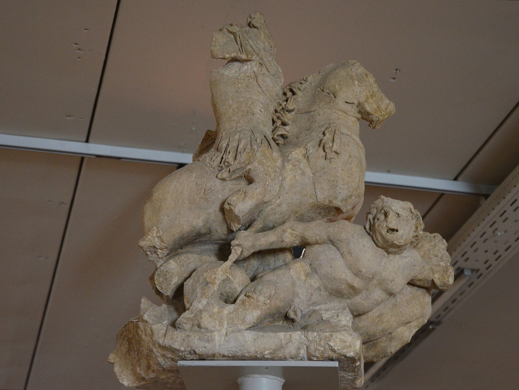 Jupiter Column, a statue group portraying Jupiter on horseback trampling giants with serpent bodies, 150-175 AD. Gallo-Roman Museum of Tongeren, Belgium.