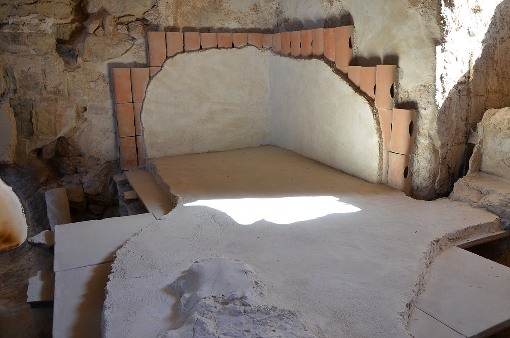 A section of the hot room (caldarium) in Herod's large bathhouse with clay pipes along the walls that were used to allow the hot air to warm up the side of the pool.