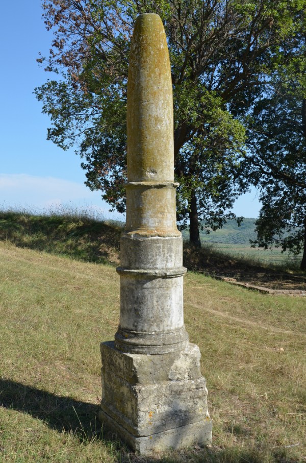 The Apollo Obelisk, a Greek monolithic limestone column dedicated to the god Apollo as Agyieus, protector of streets and houses, the cylinder would have been ornamented with Apollo's lyre as well as the bow and quiver of Artemis.