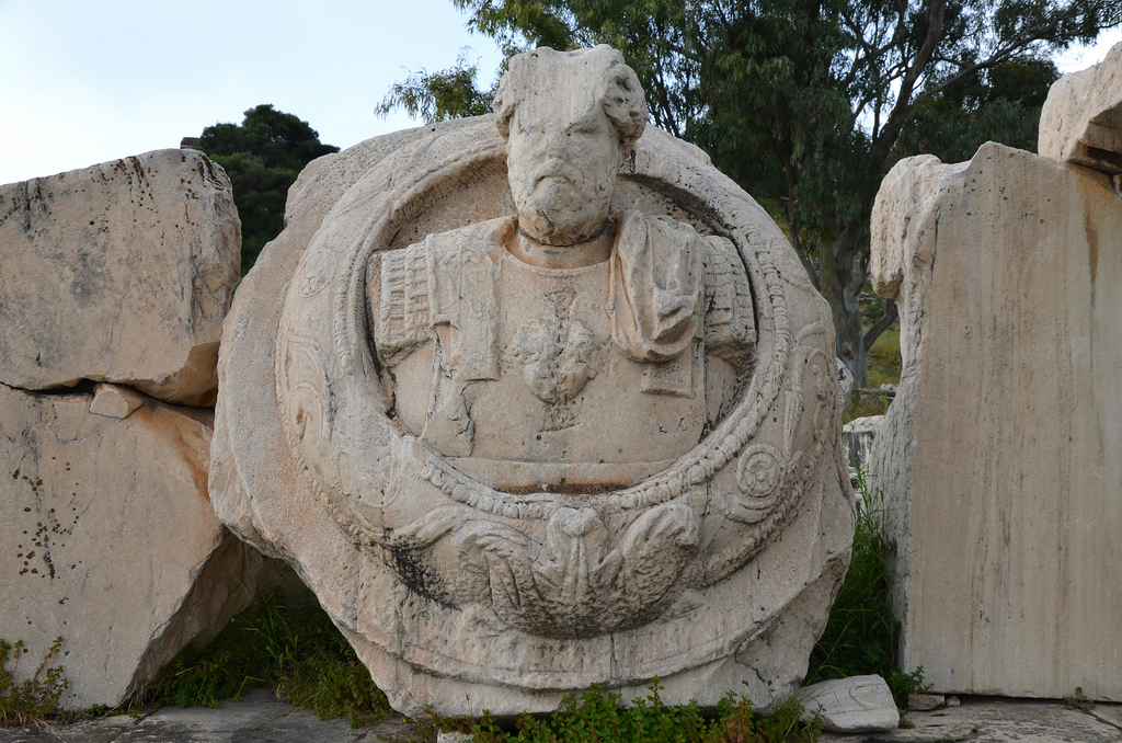 This cuirassed bust of an emperor was installed at the centre of the pediment of the Greater Propylaea. Although the face is badly damaged, it is thought to be a portrait of the emperor Marcus Aurelius who built the Greater Propylaea.