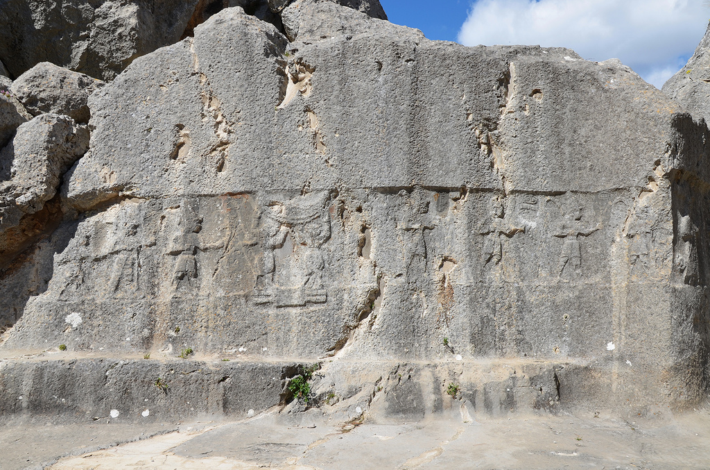 Chamber A, two bull men stand between male gods on the hieroglyphic symbol of the earth and supporting the sky.