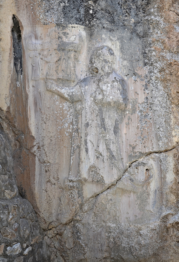 Chamber A, relief depicting the sanctuary's founder, King Tudhaliya IV, standing on two mountains.