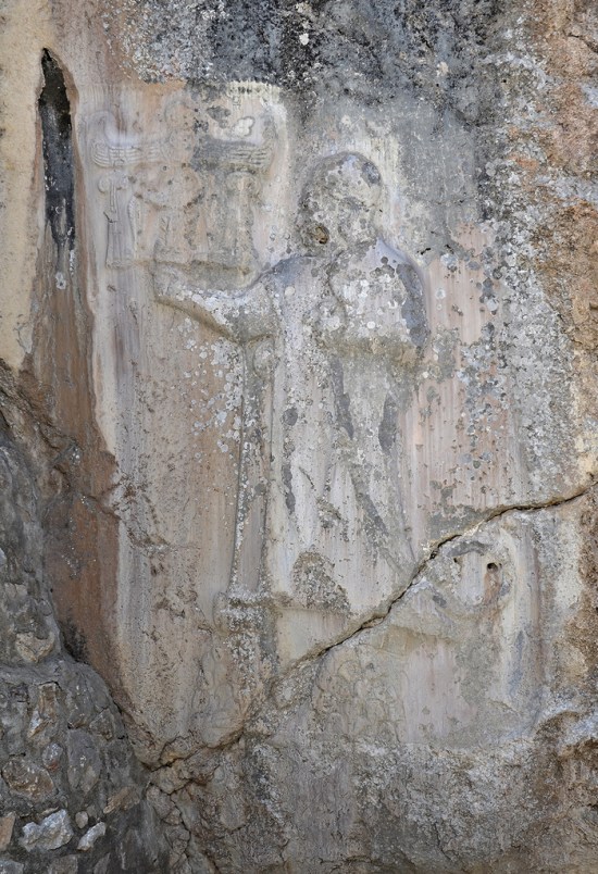 Chamber A, relief depicting the sanctuary's founder, King Tudhaliya IV, standing on two mountains.