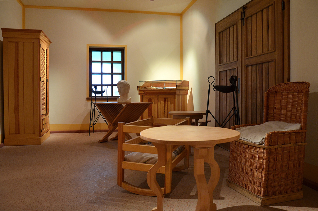 Furniture reproductions, stools, tables, cupboards exhibited in the adjacent rooms.