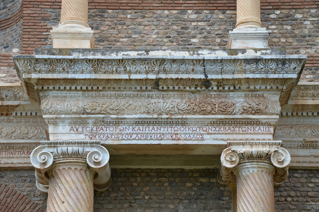 The inscription on the first story (with red-painted letters) dedicates this space to the Roman Imperial family: Emperors Caracalla and Geta, and their mother Julia Domna; and records that the hall was gilded by the city and two ladies of consular rank.