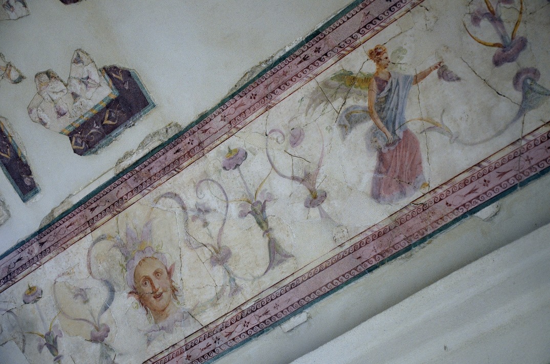The upper cubiculum so-called “Emperor’s Study”: painted frieze on the ceiling with winged female figure, satyr’s head and plant-shaped motifs.