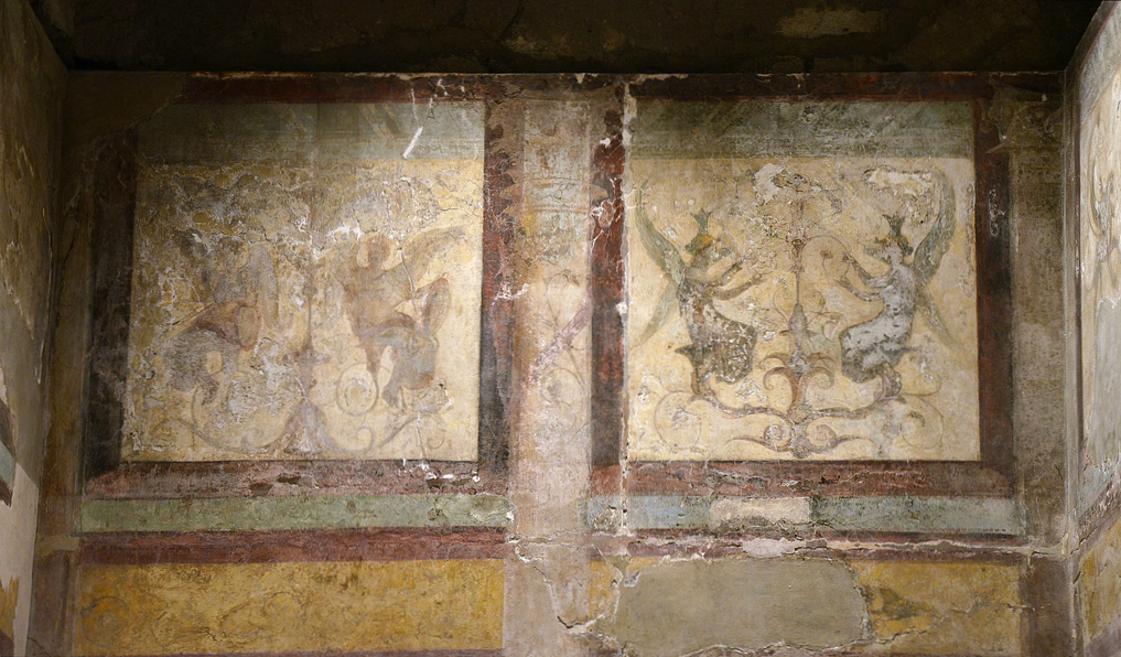 Fresco detail in the upper zone of the left-hand room with winged females figures, perhaps Victories.