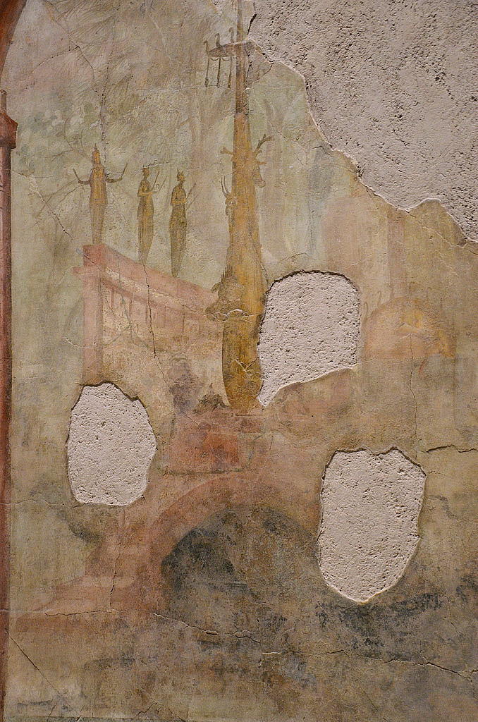 Fresco detail in the right wall of the triclinum depicting a sacred and rural landscape.